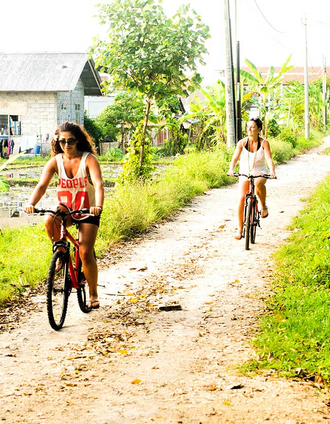 Bali wellness retreat, ladies riding bikes